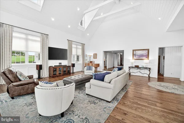 a bathroom with a granite countertop toilet a sink and a mirror