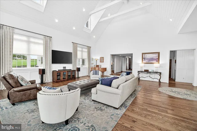 a bathroom with a granite countertop toilet a sink and a mirror