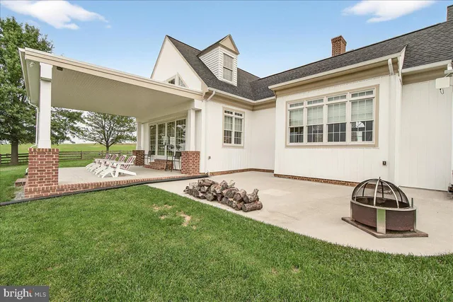 a bed room with a bed a couch and a book shelf
