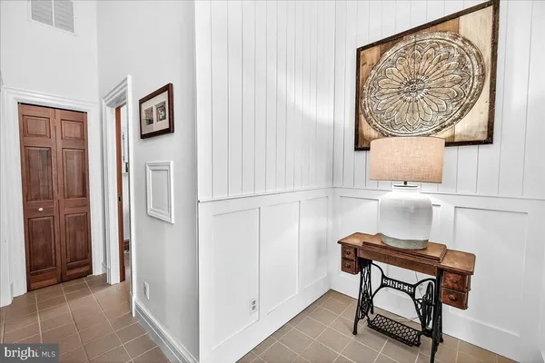 a bathroom with a sink mirror and toilet