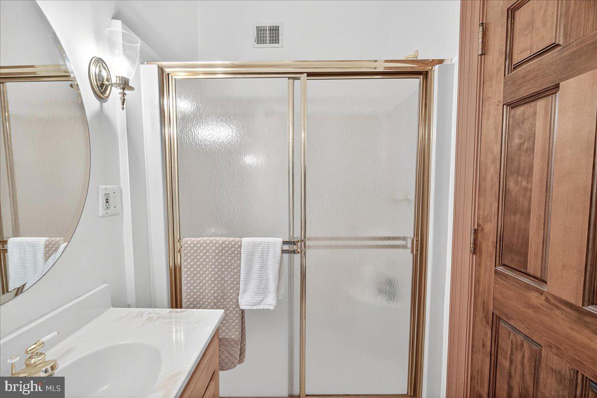 9522 Bessie Clemson Road Union Bridge, MD 21791 - Photo 36 of 107 a bathroom with a shower and a mirror