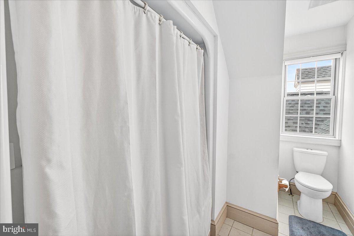 9522 Bessie Clemson Road Union Bridge, MD 21791 - Photo 54 of 107 a bathroom with a toilet and a shower curtain