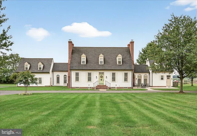 a view of a livingroom with furniture and staircase