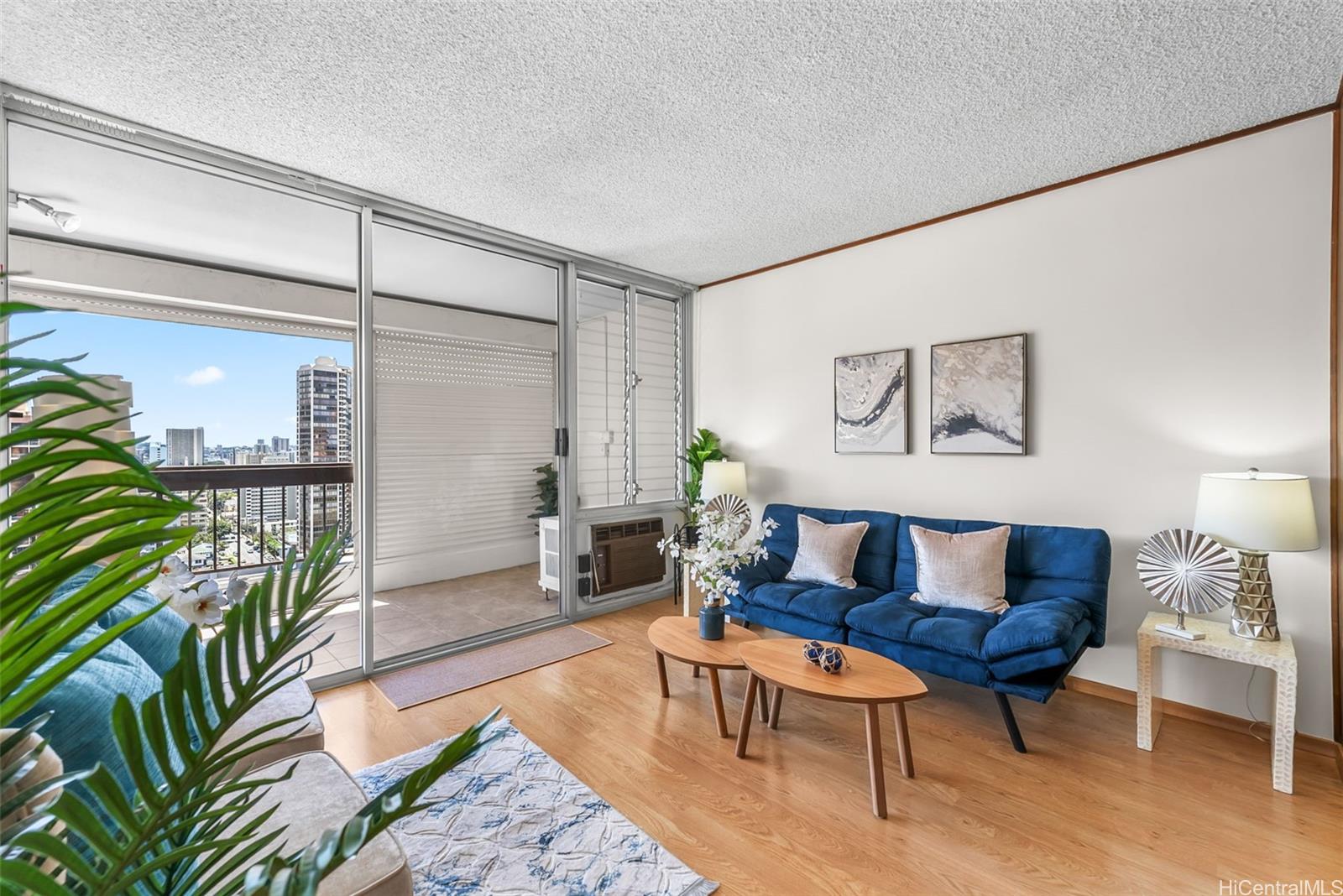 775 Kinalau Place, Unit 1907 Honolulu, HI 96813 - Photo 1 of 1 a living room with furniture and a rug