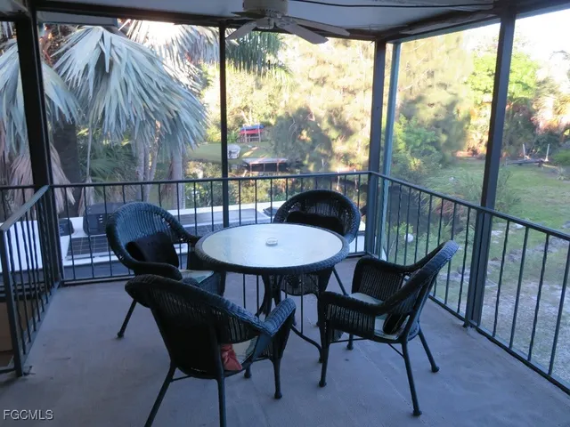 a view of a chairs and table in patio