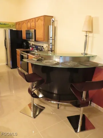 a view of a kitchen with a sink and cabinets