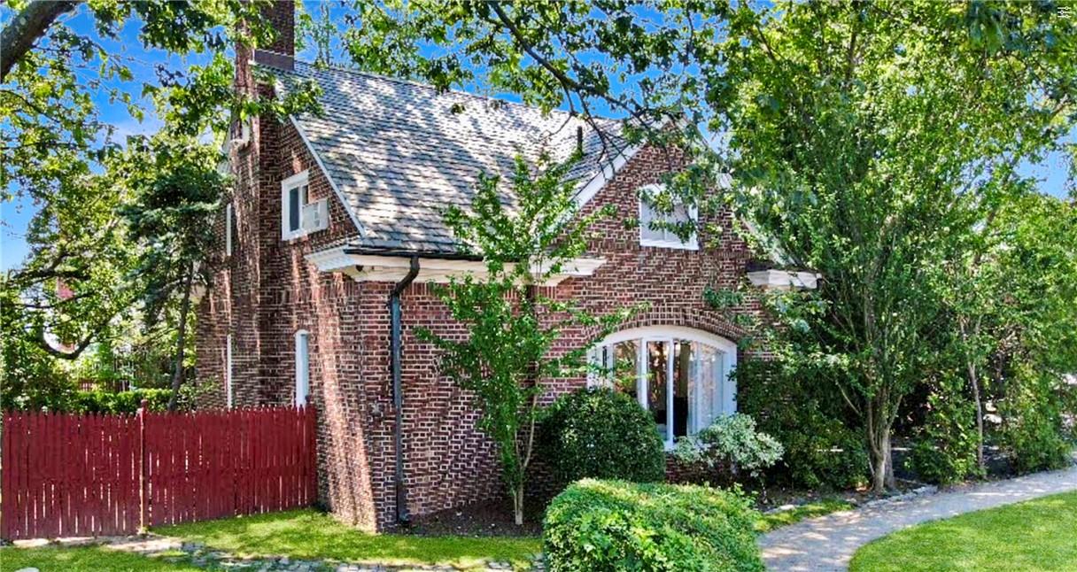 303 Centre Avenue New Rochelle, NY 10805 - Photo 1 of 1 a front view of a house with a garden