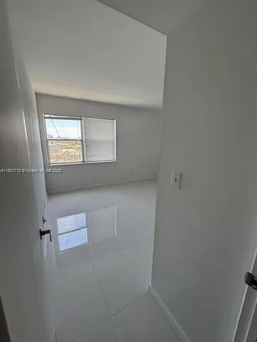 a kitchen with stainless steel appliances granite countertop a sink and a refrigerator