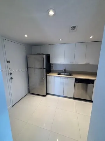 a living room with lots of furniture and lots of furniture