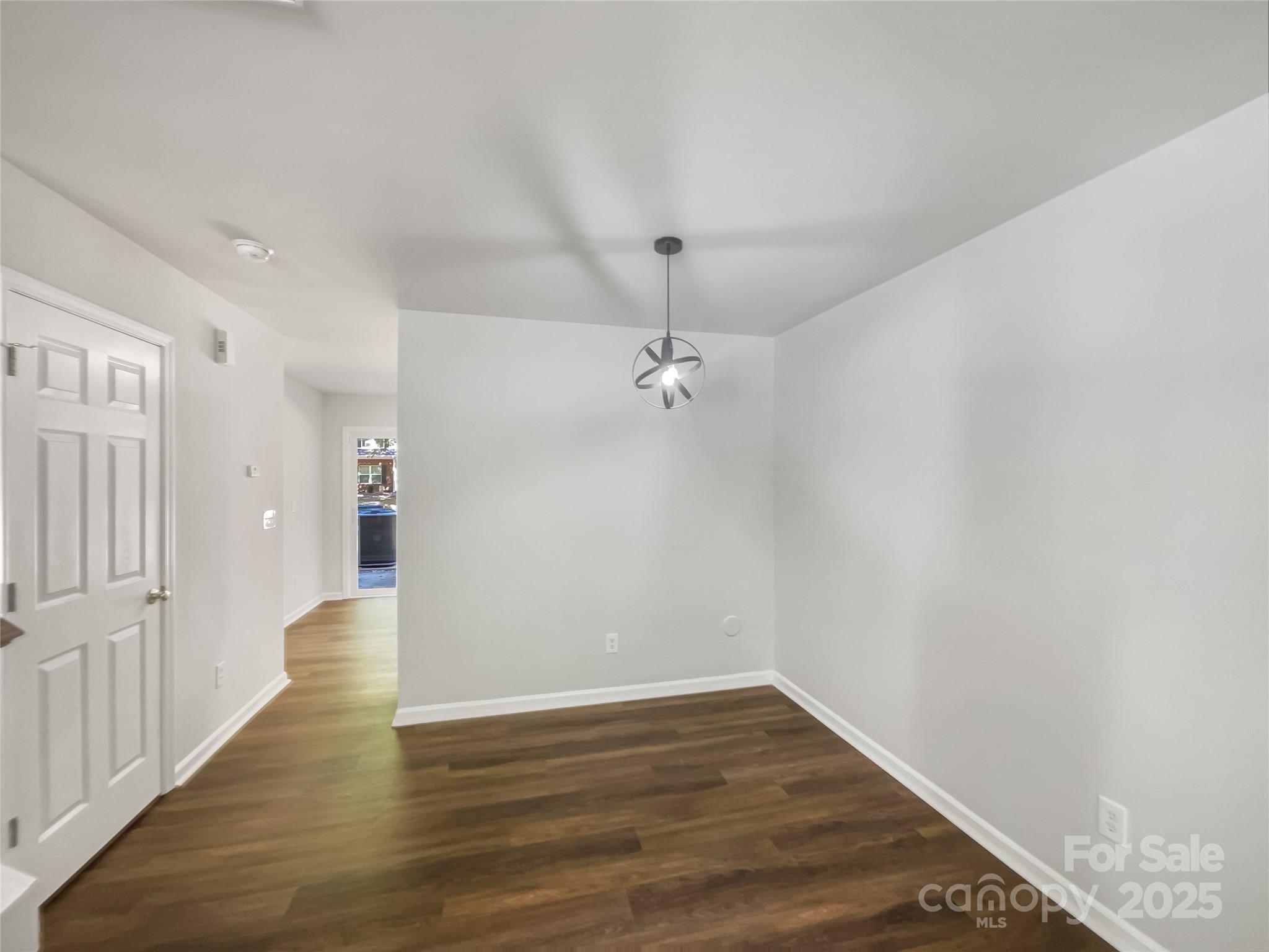 146 Marakery Road, Unit B Mooresville, NC 28115 - Photo 12 of 19 wooden floor in an empty room with a window