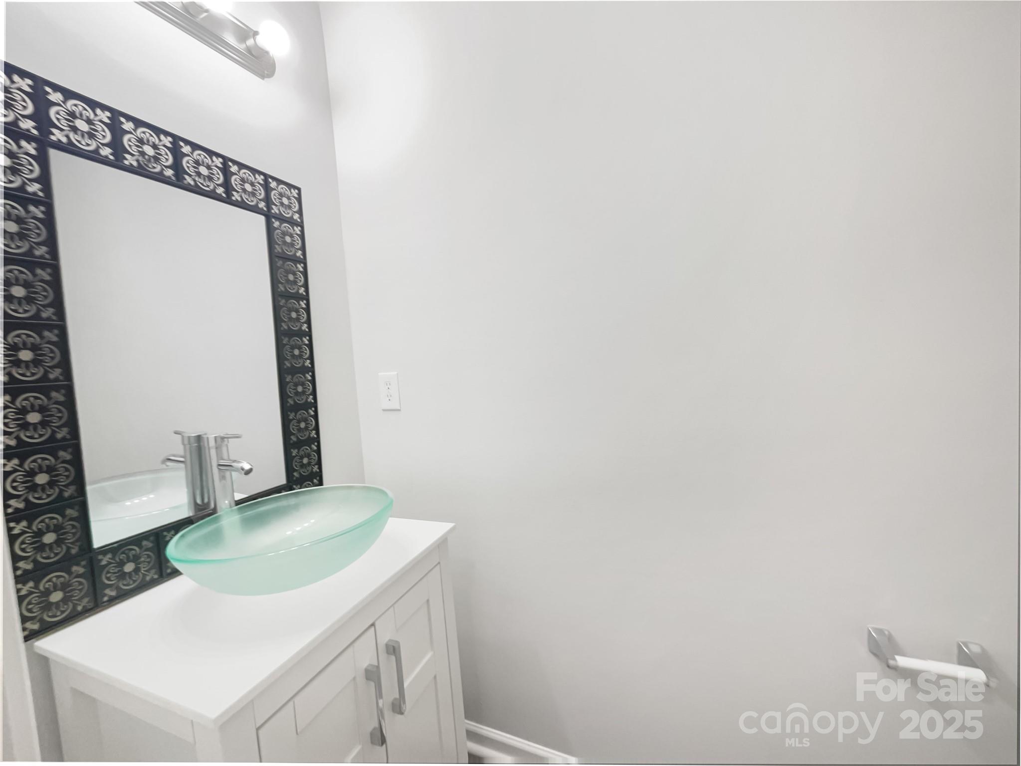 146 Marakery Road, Unit B Mooresville, NC 28115 - Photo 14 of 19 a bathroom with a sink vanity and a mirror