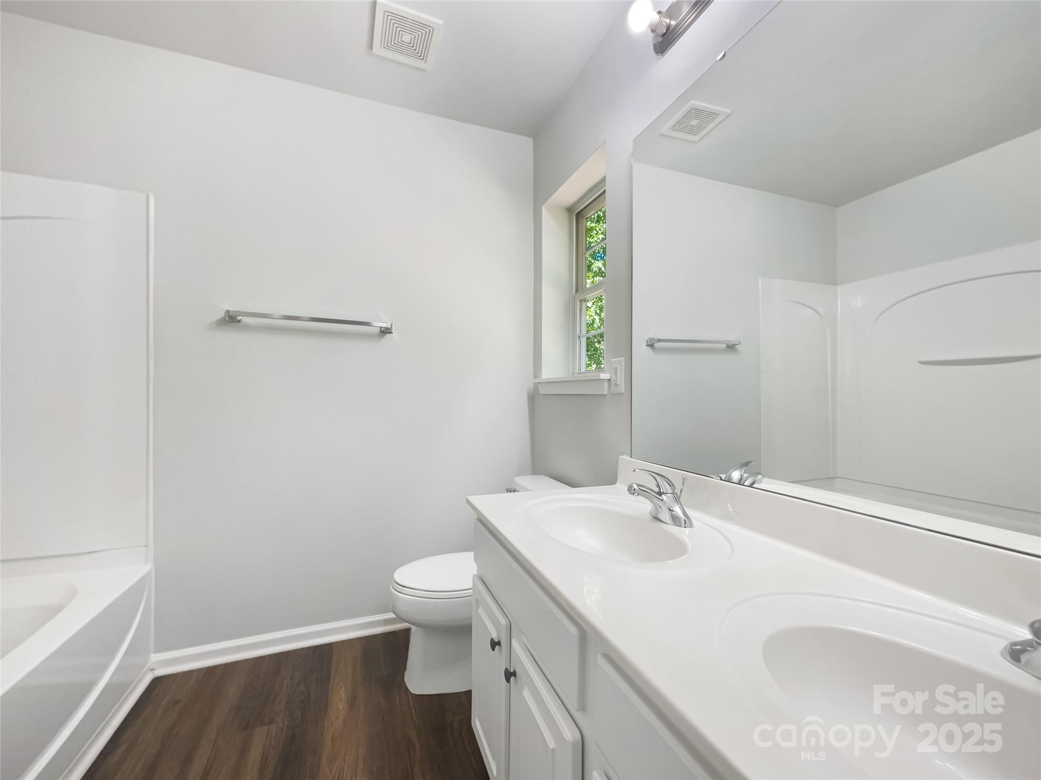 146 Marakery Road, Unit B Mooresville, NC 28115 - Photo 17 of 19 a bathroom with a sink and a mirror
