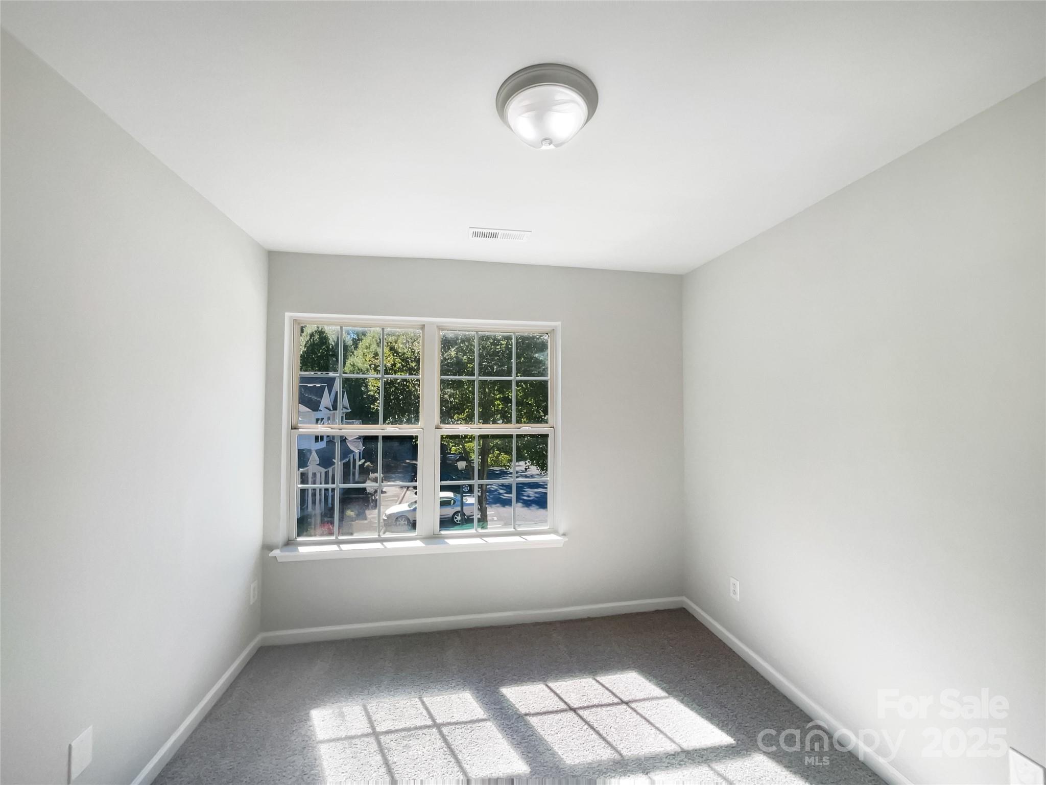 146 Marakery Road, Unit B Mooresville, NC 28115 - Photo 18 of 19 an empty room with windows