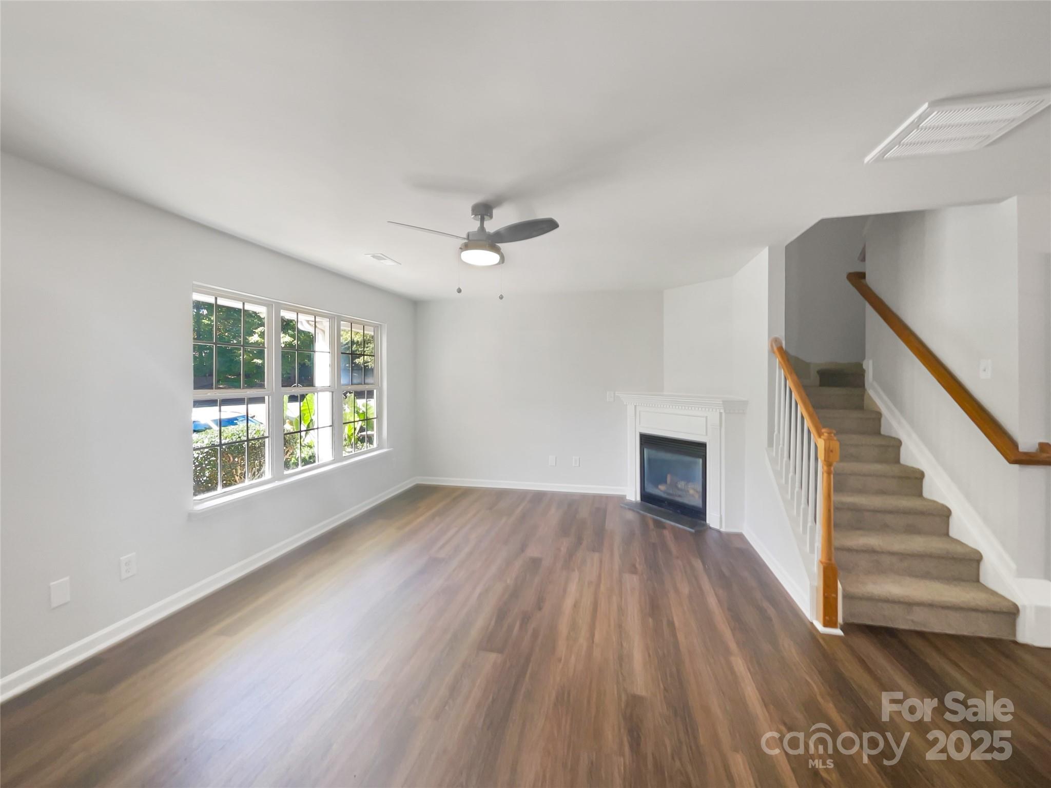 146 Marakery Road, Unit B Mooresville, NC 28115 - Photo 3 of 19 a view of empty room with wooden floor and fan