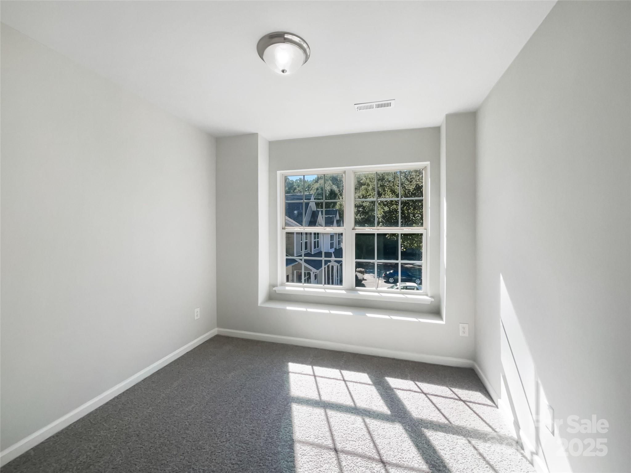 146 Marakery Road, Unit B Mooresville, NC 28115 - Photo 5 of 19 an empty room with a window