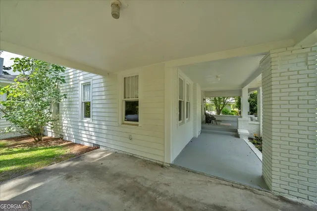 a view of a porch with hardwood