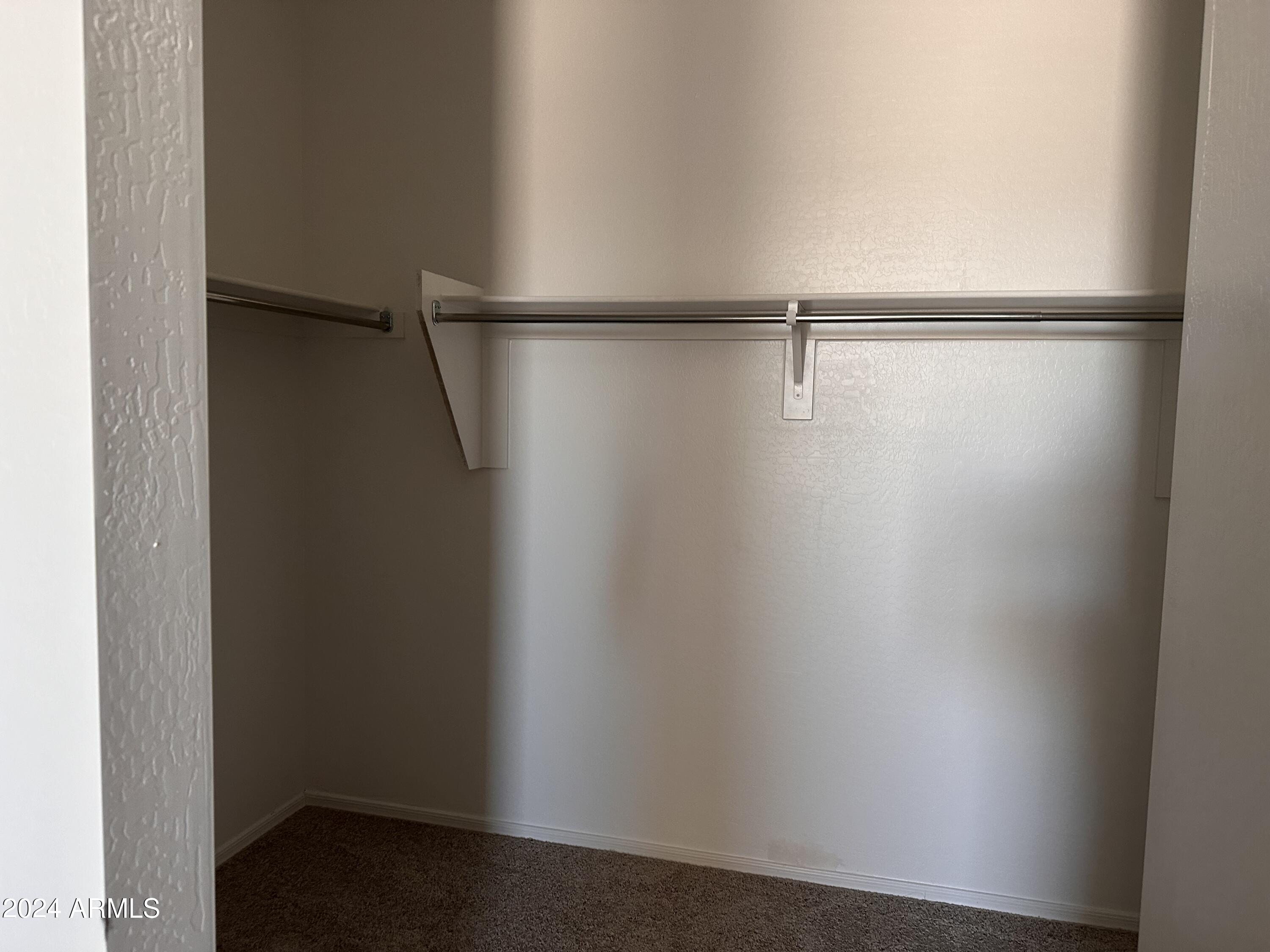24092 West Pecan Road Buckeye, AZ 85326 - Photo 20 of 27 19-Primary bedroom walk-in closet
