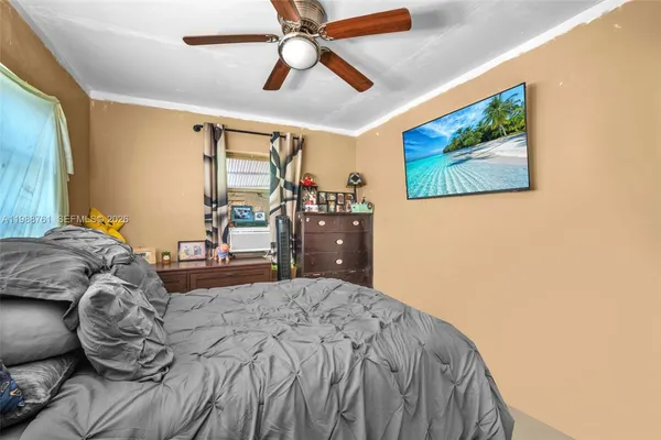 a bathroom with a sink and mirror with toilet