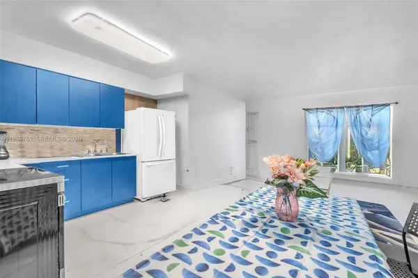 a kitchen with a sink and wooden cabinets