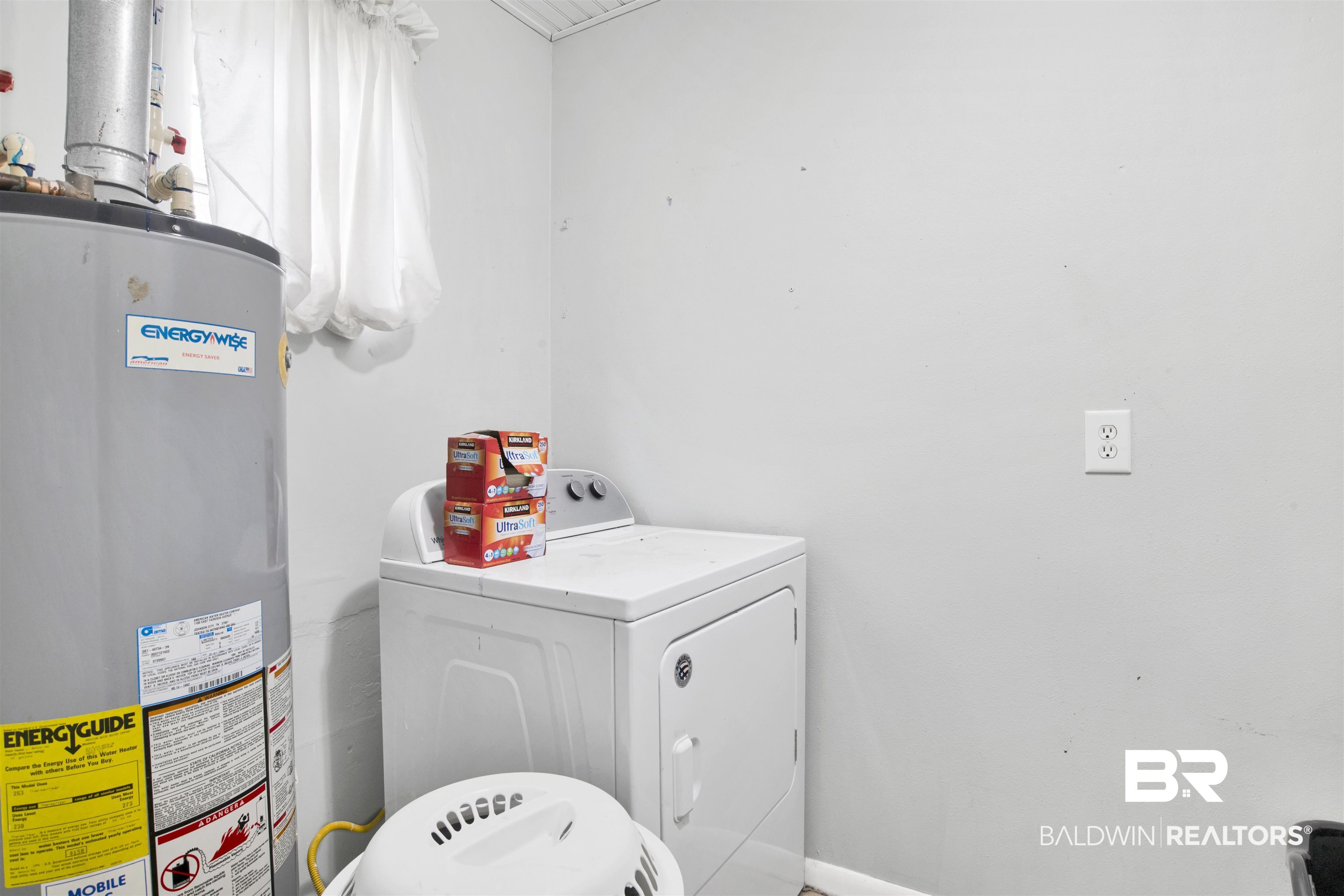10244 Magnolia Road Irvington, AL 36544 - Photo 21 of 37 Clothes washing area with water heater, washer and clothes dryer, and laundry area