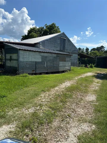 a view of a backyard of the house