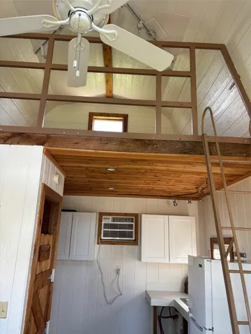 a bathroom with a shower and a sink