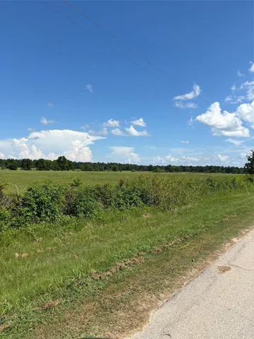 a view of a lake with a yard