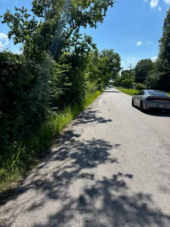 a view of a road with a yard