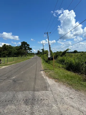 a view of a fountain in front of a house