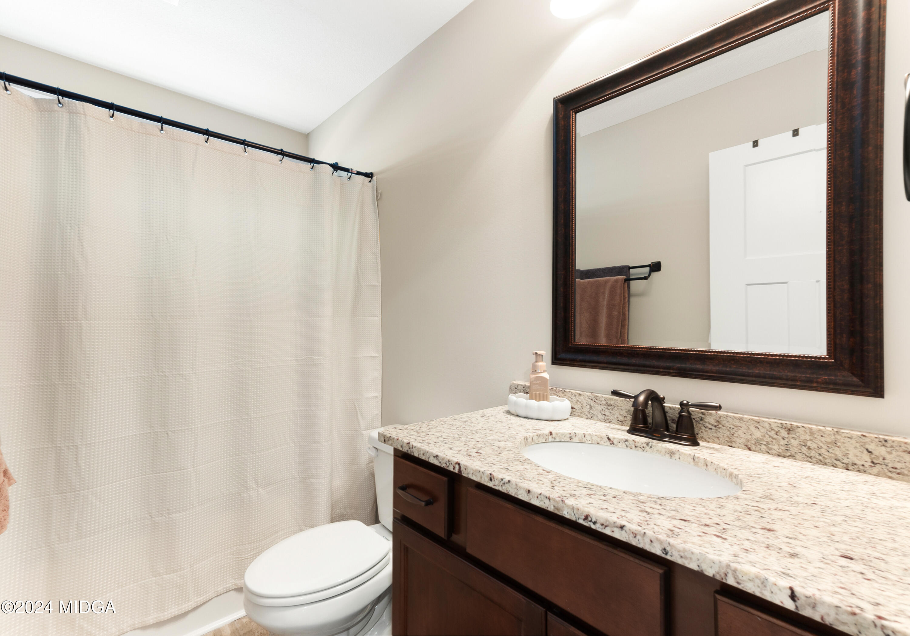 150 Hawks Rdg Trace Byron, GA 31008 - Photo 38 of 51 a bathroom with a granite countertop sink and a mirror