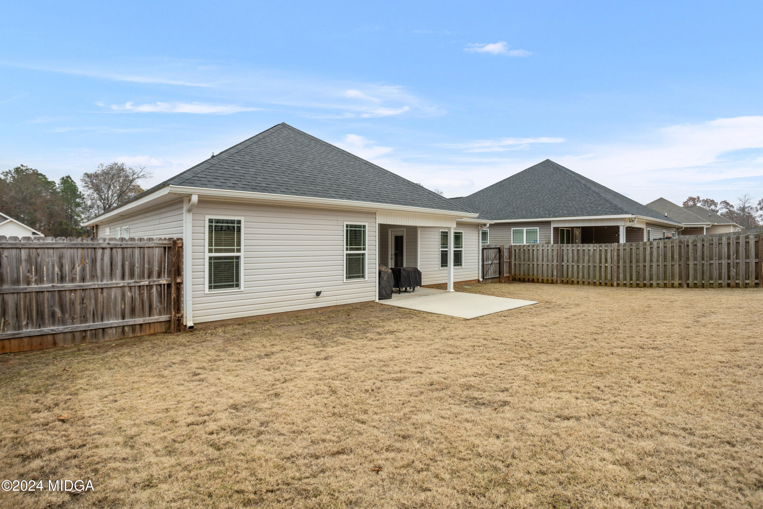 150 Hawks Rdg Trace Byron, GA 31008 - Photo 50 of 51 a front view of a house with a garden and yard