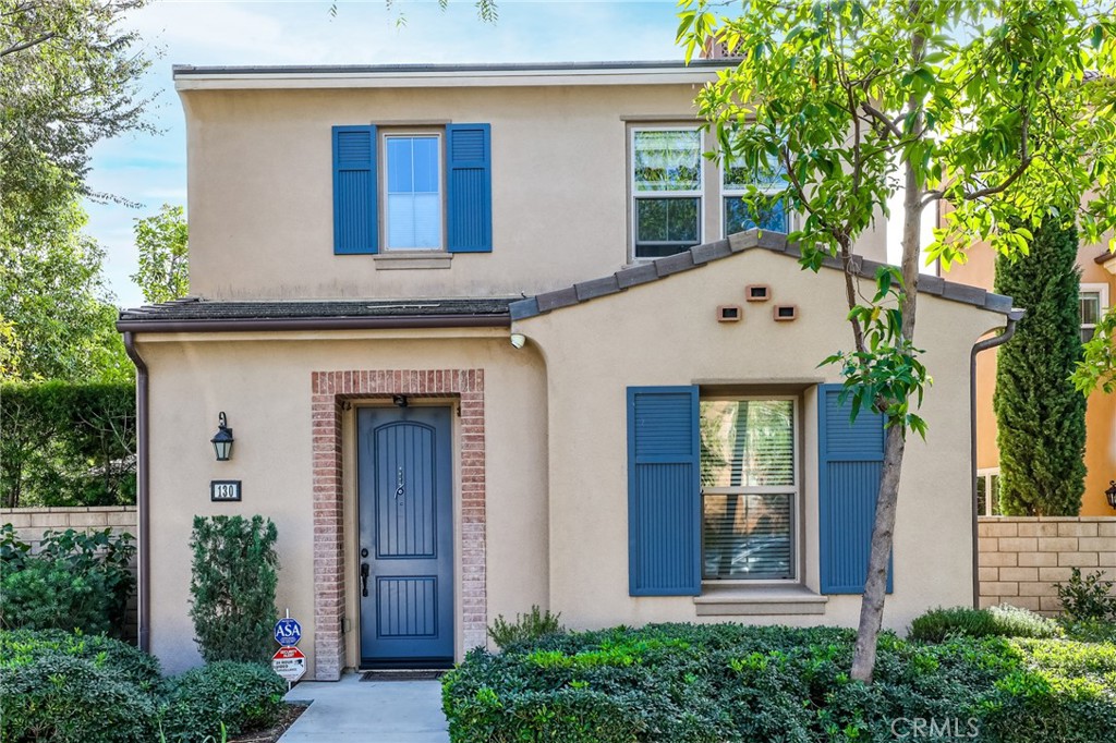 front view of the house with potted plants