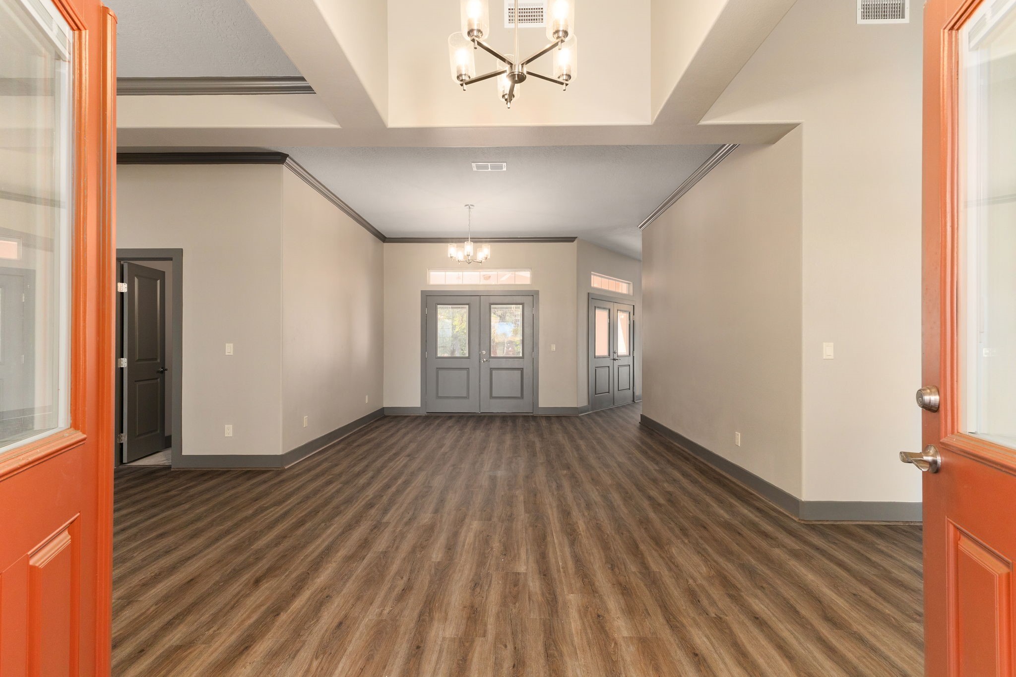 250 Bucek Lane Schulenburg, TX 78956 - Photo 2 of 45 a view of an empty room with wooden floor and a window