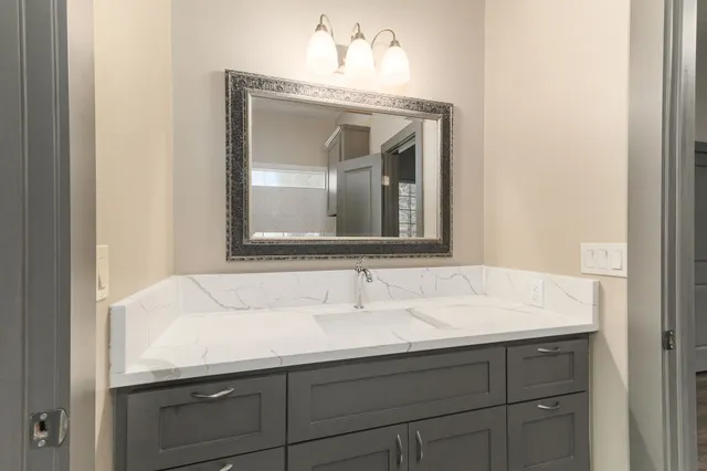 an empty room with closet and a hallway