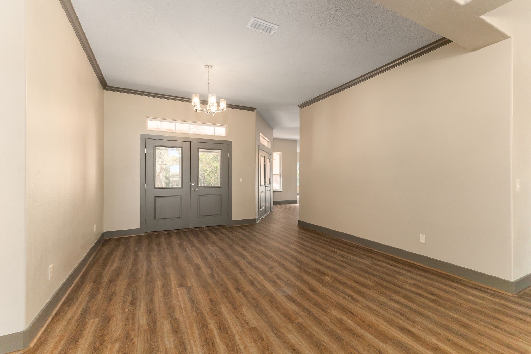 250 Bucek Lane Schulenburg, TX 78956 - Photo 3 of 45 wooden floor in an empty room with a window