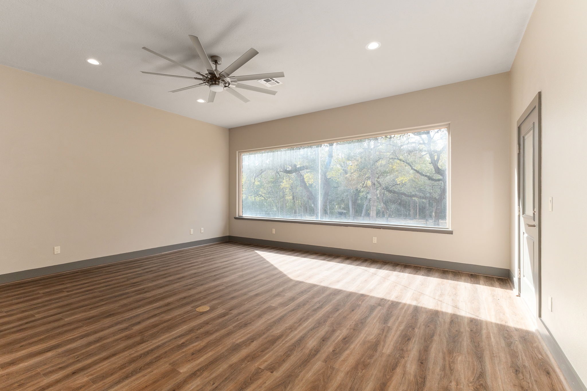 250 Bucek Lane Schulenburg, TX 78956 - Photo 6 of 45 wooden floor in an empty room with a window