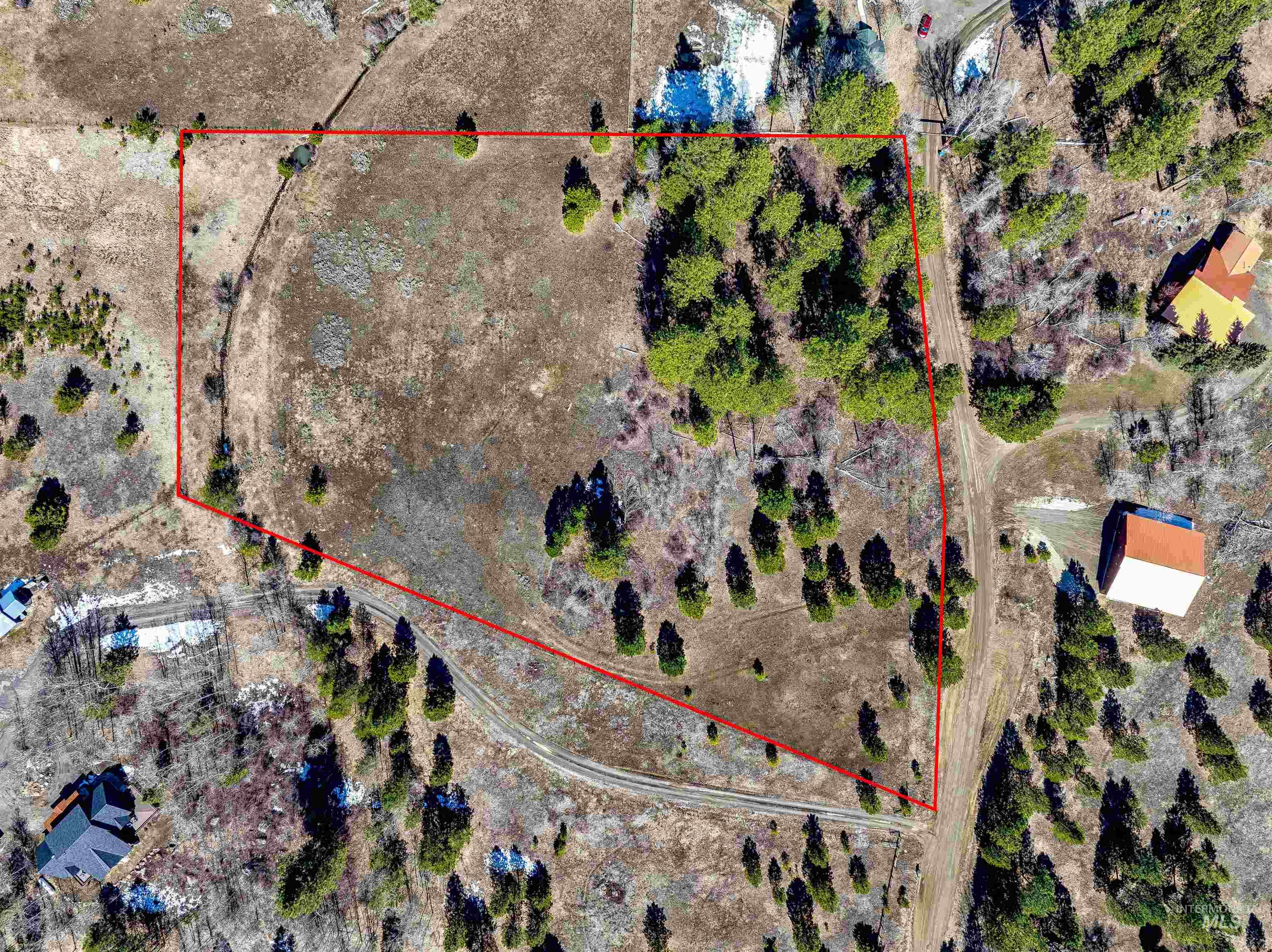 14055 Deerfield Road McCall, ID 83638 - Photo 10 of 19 Aerial view of sparsely populated area featuring property parcel outlined