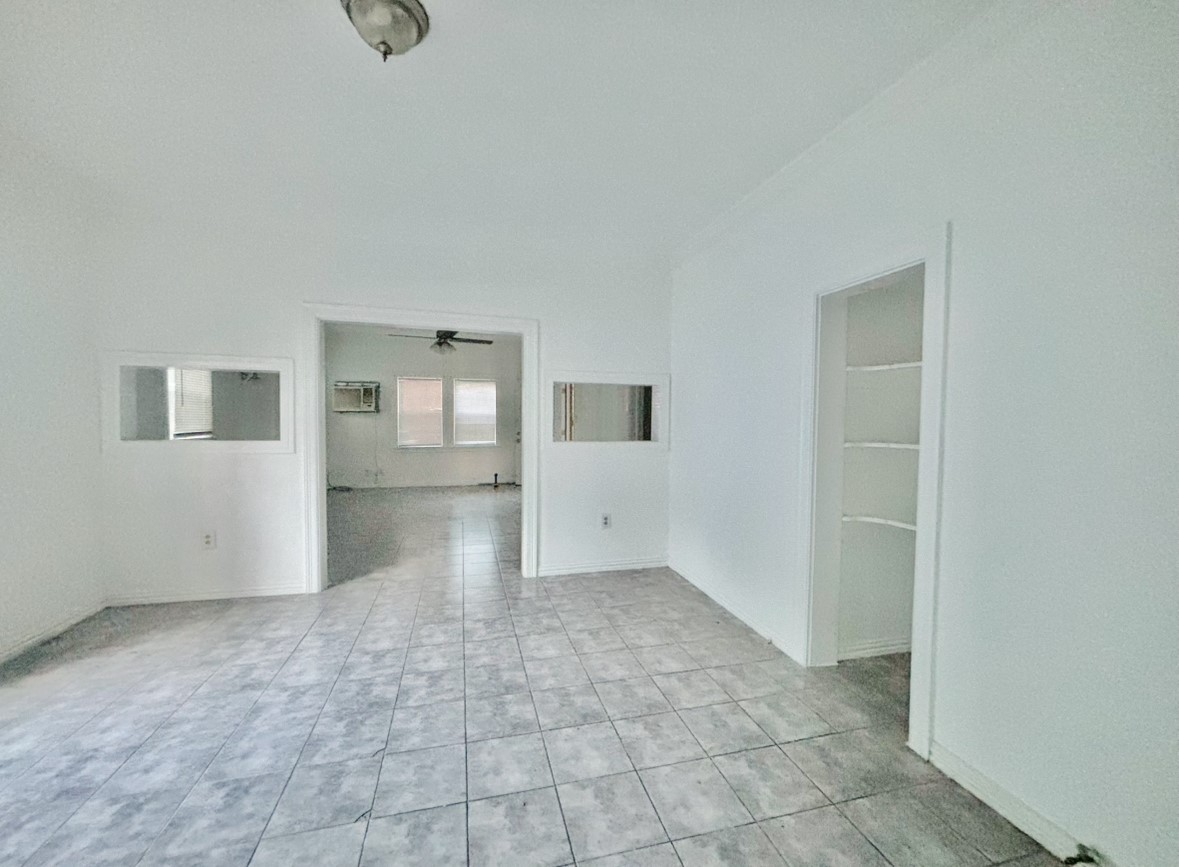 6124 Goforth Street Houston, TX 77021 - Photo 5 of 21 an empty room with a empty space and windows