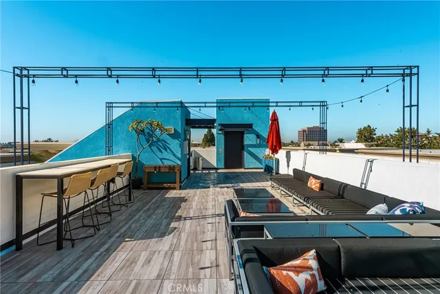 a kitchen with stainless steel appliances a refrigerator and a stove