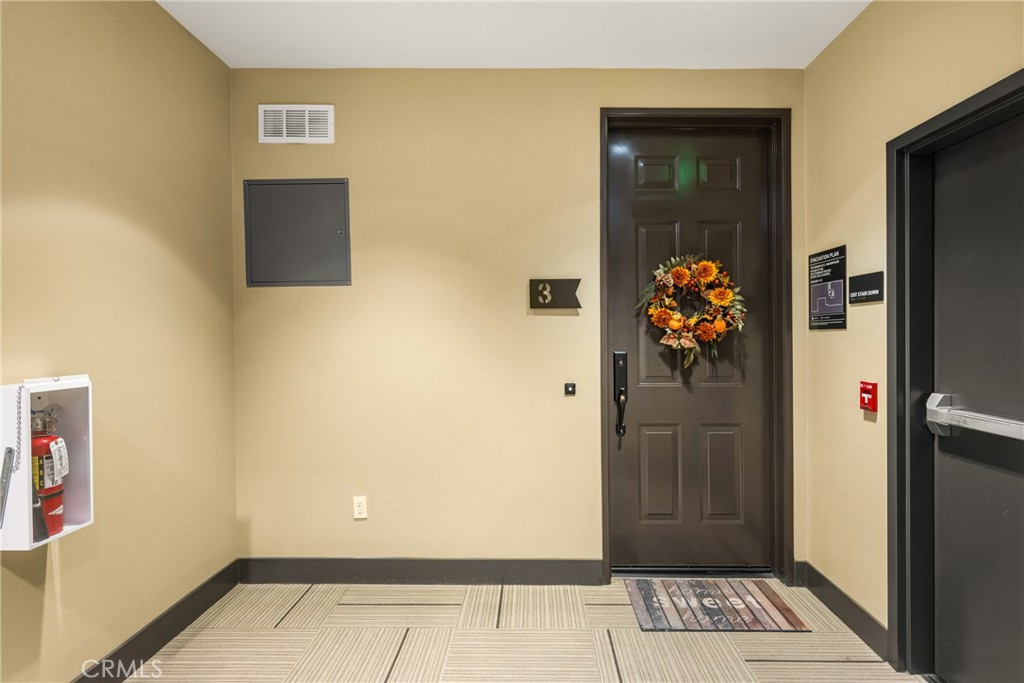 425 South Anaheim Boulevard, Unit 3 Anaheim, CA 92805 - Photo 17 of 53 a view of a hallway with wooden floor and a cabinet