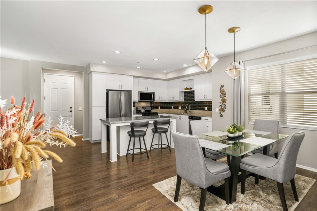 425 South Anaheim Boulevard, Unit 3 Anaheim, CA 92805 - Photo 34 of 53 a dining room with furniture a window and wooden floor