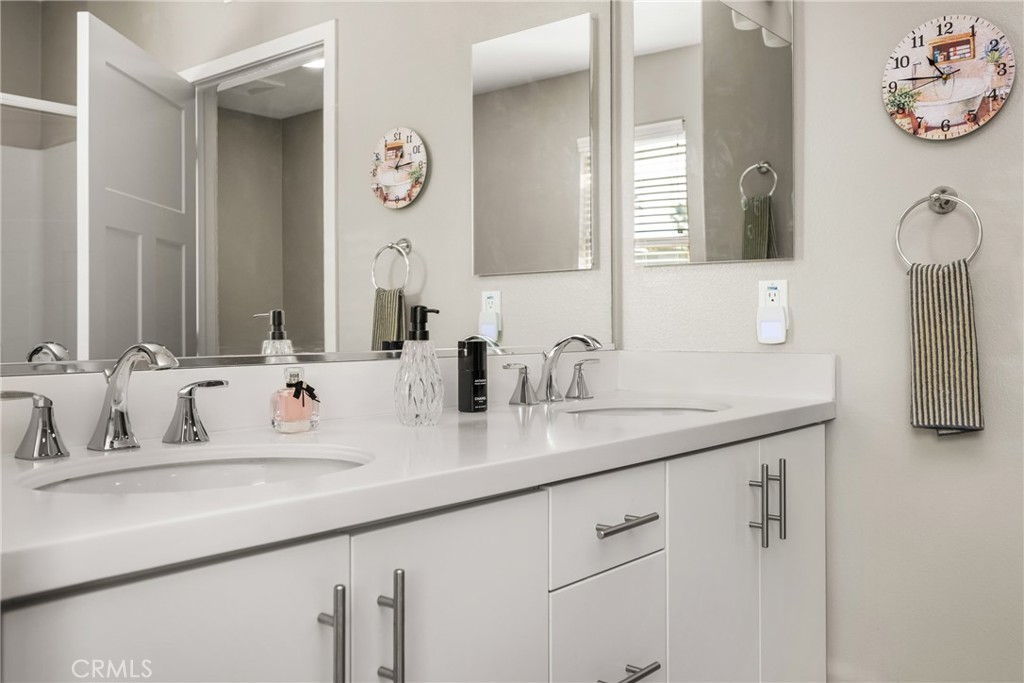 425 South Anaheim Boulevard, Unit 3 Anaheim, CA 92805 - Photo 50 of 53 a bathroom with double vanity sinks and a mirror