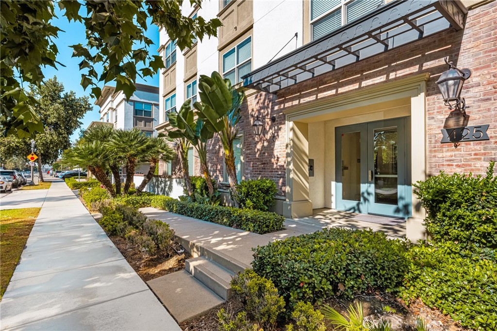 425 South Anaheim Boulevard, Unit 3 Anaheim, CA 92805 - Photo 5 of 53 a view of a house with potted plants and a fountain