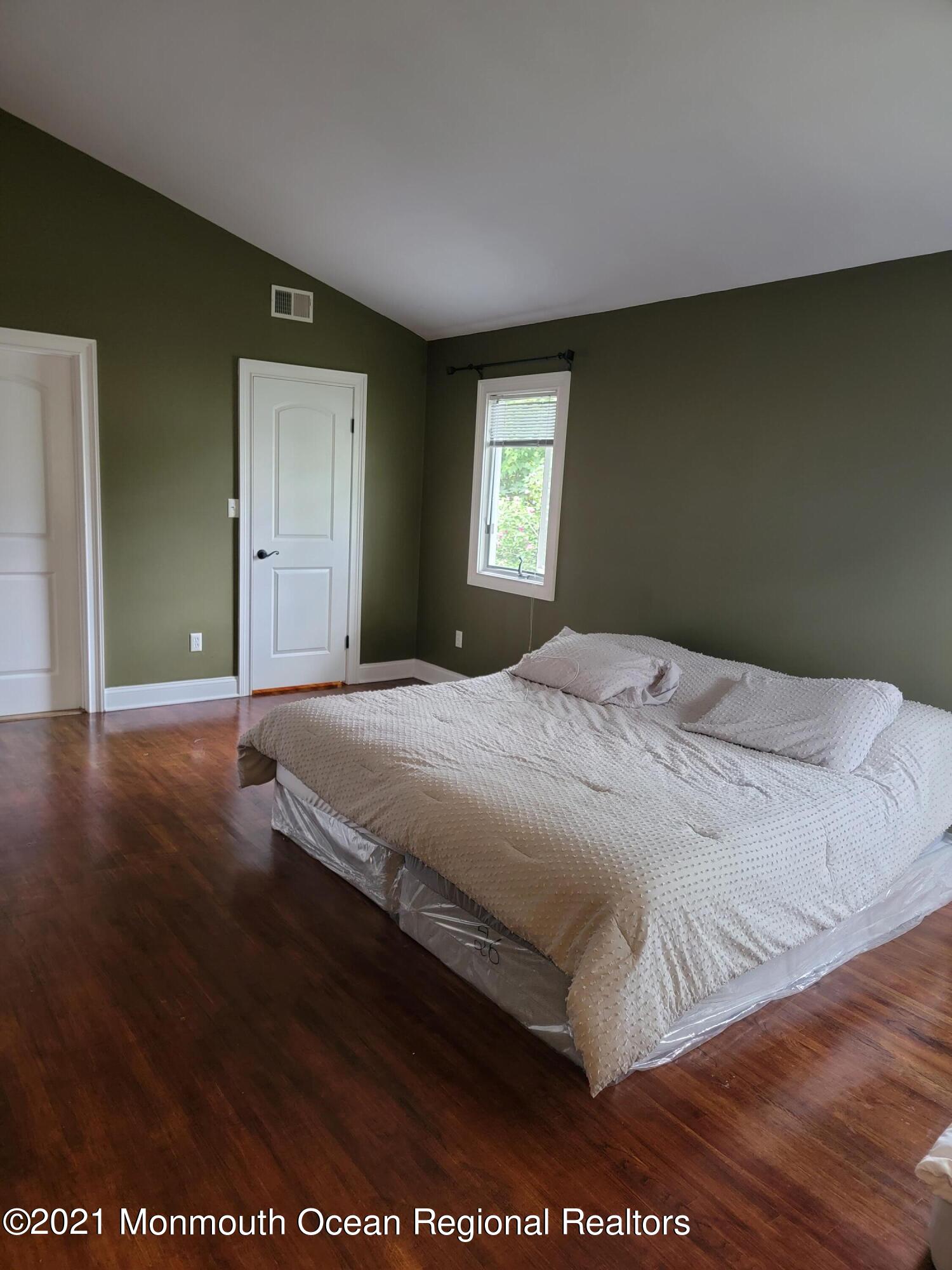 28 Musket Lane Eatontown, NJ 07724 - Photo 11 of 26 a bedroom with a bed and a window