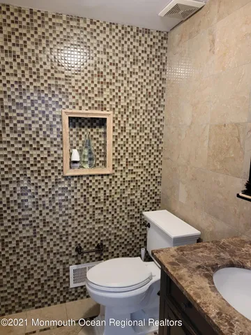 a bathroom with a bathtub and window