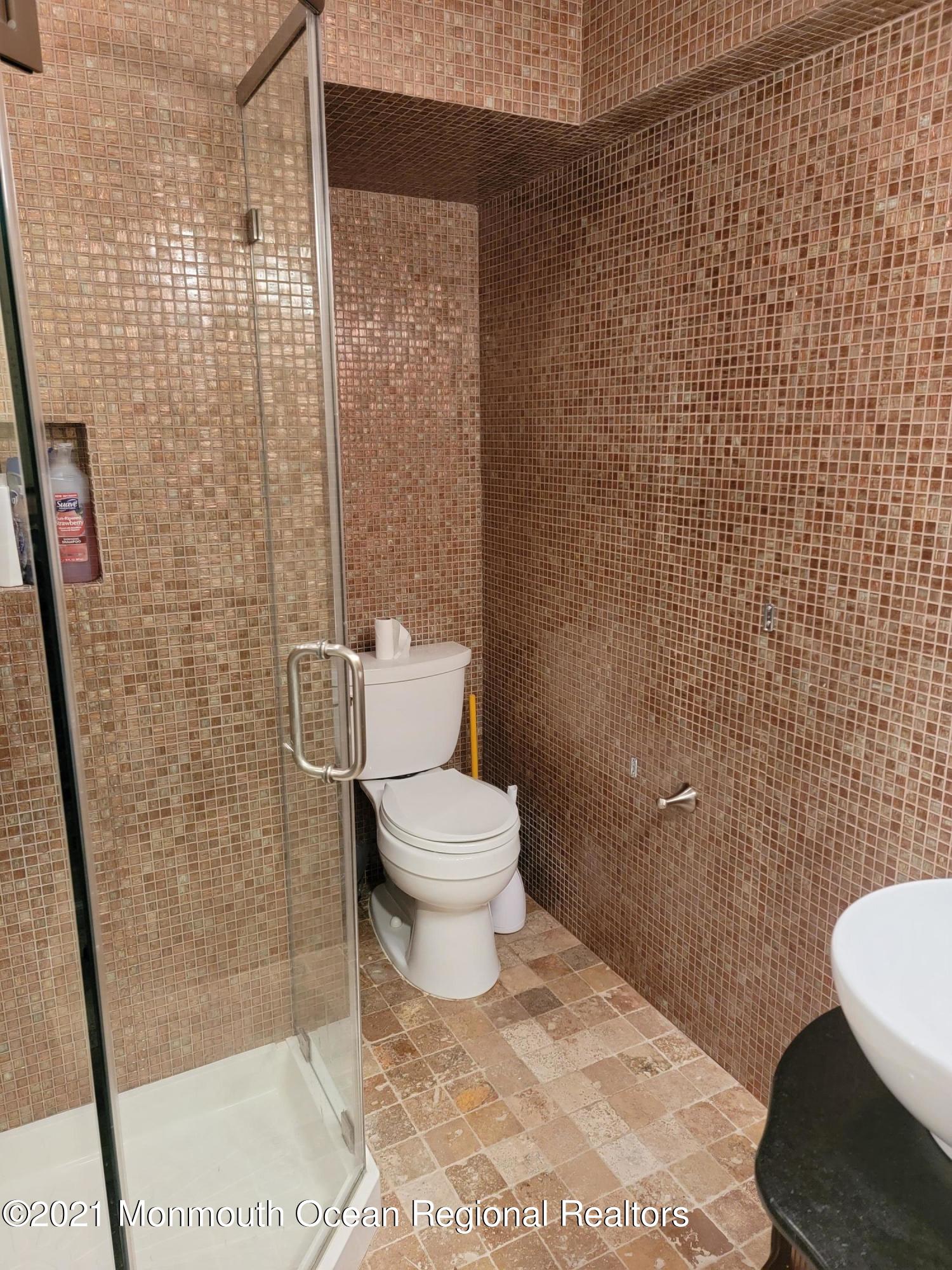 28 Musket Lane Eatontown, NJ 07724 - Photo 20 of 26 a bathroom with a toilet and a shower