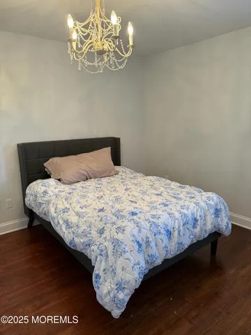 a spacious bedroom with a bed and a table