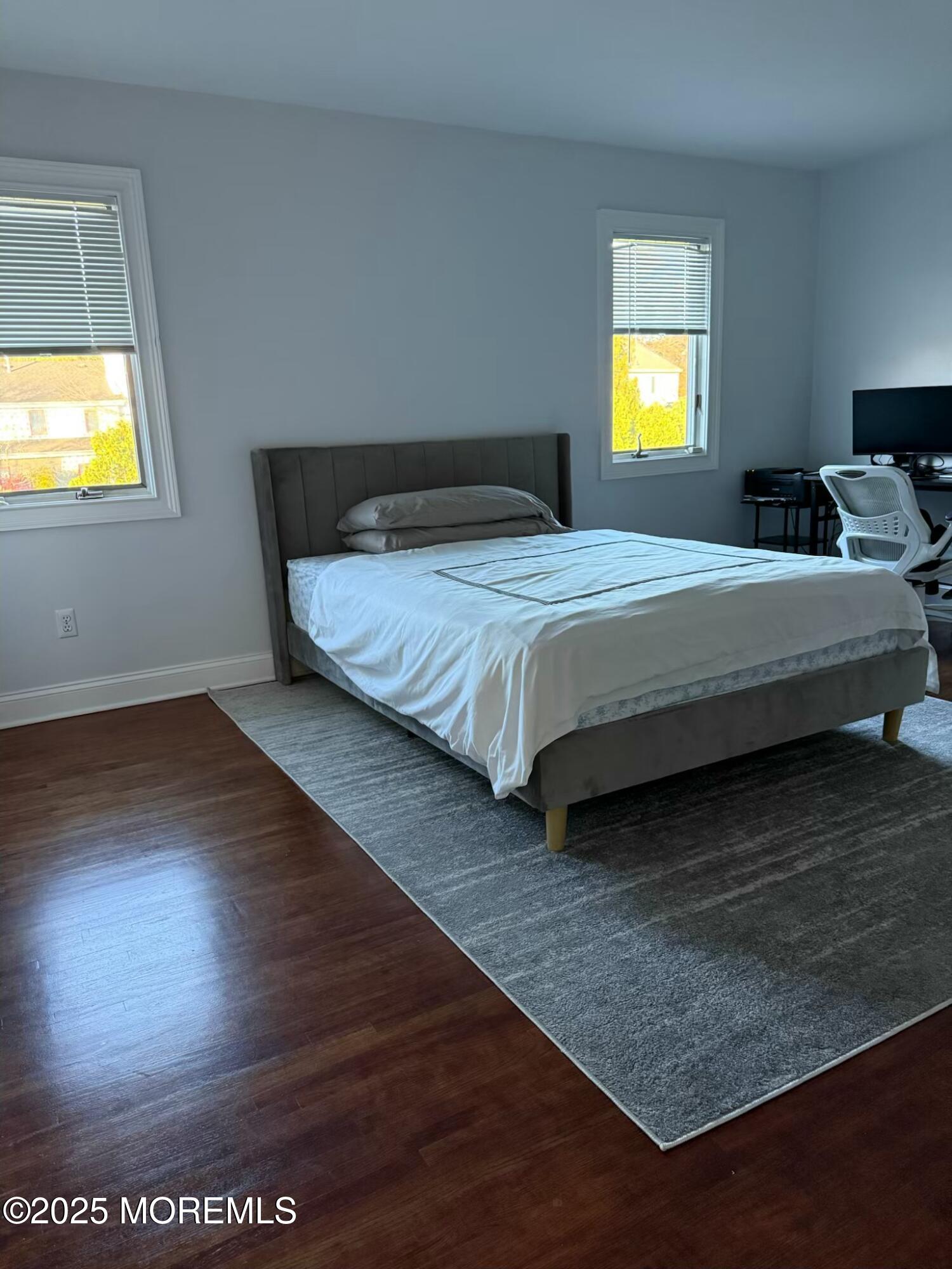 28 Musket Lane Eatontown, NJ 07724 - Photo 25 of 26 a spacious bedroom with a bed and a table