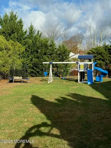 a view of a dining room with furniture and window