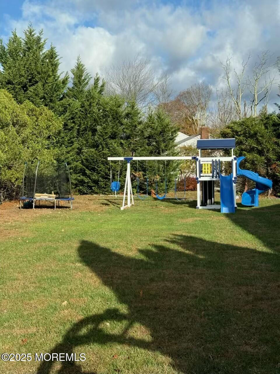 28 Musket Lane Eatontown, NJ 07724 - Photo 3 of 26 a view of building with trees in the background